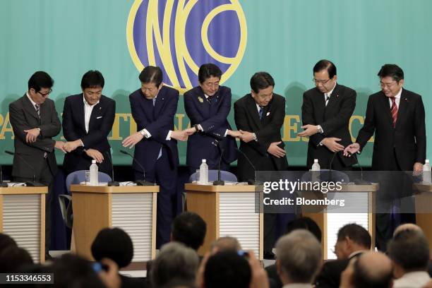 Ichiro Matsui, mayor of Osaka and leader of the Nippon Ishin , from left, Yuichiro Tamaki, leader of the Democratic Party for the People, Natsuo...