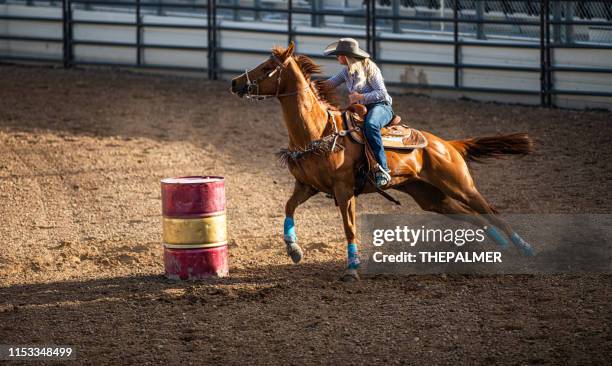 young cowgirl barrel racing rodeo - barrel race stock pictures, royalty-free photos & images