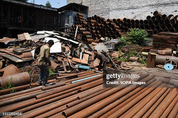 Scrap Shop Worker Labourers work inside a scrap shop in Srinagar. Recycling scrap... News ...
