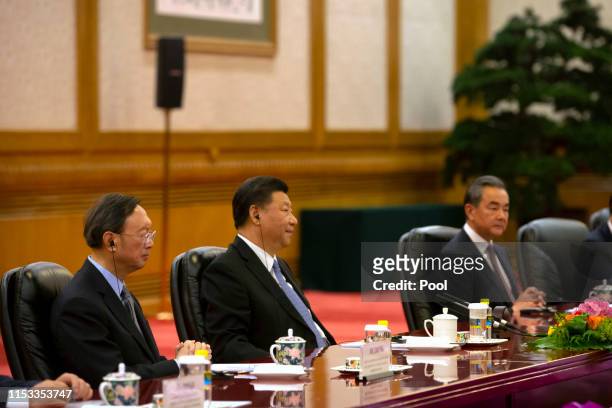 Chinese Politburo Member Yang Jiechi, Chinese President Xi Jinping and Chinese Foreign Minister Wang Yi listen as Bulgarian President Rumen Radev...