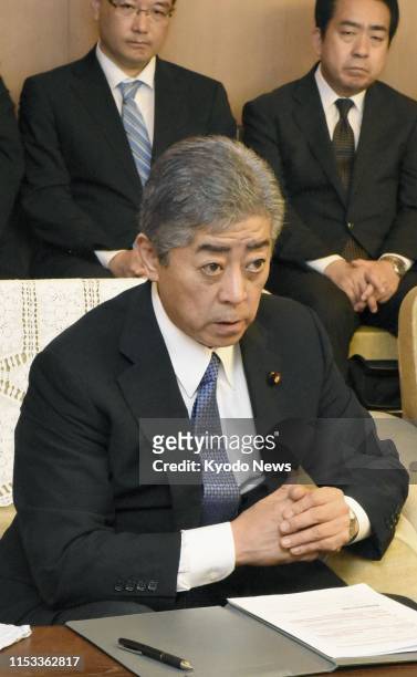 Defense Minister Takeshi Iwaya apologizes to Yamaguchi Gov. Tsugumasa Muraoka at the prefectural government office on July 3 over a mistake in the...