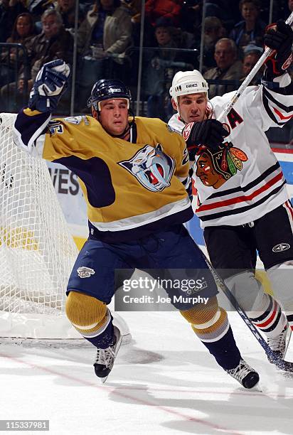 Predators Steve Sullivan battles with Matthew Barnaby in the second period. The Nashville Predators beat the Chicago Blackhawks 5-3 on October 25,...