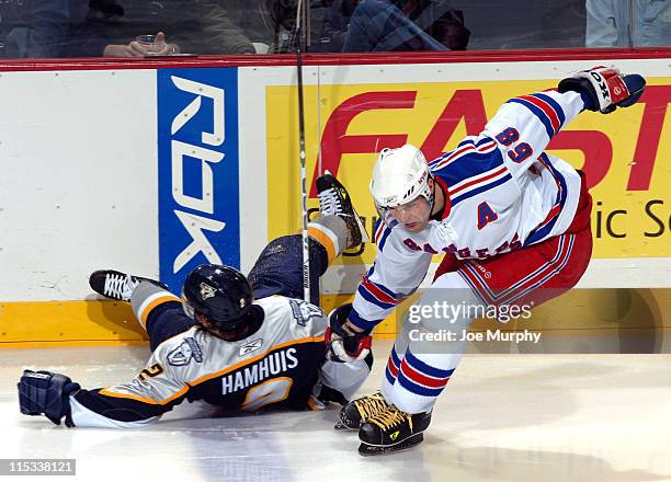 Predators Dan Hamhuis is tripped up by Rangers Jaromir Jagr during the 2nd period of the game between the New York Rangers and the Nashville...