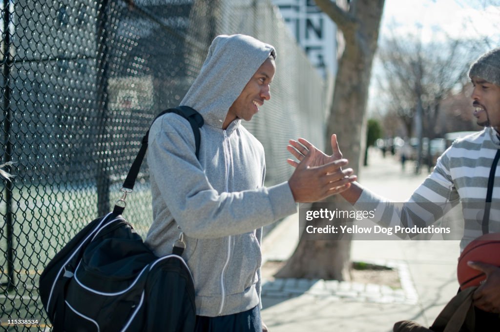 Male Friends Greeting Each Other