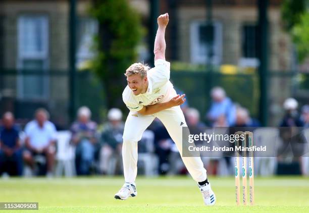 Matt Dunn of Surrey bowls during day one of the Specsavers County Championship Division One match between Surrey and Somerset at Woodbridge Road on...