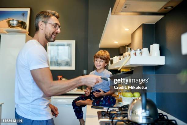 watching the pancake master in action - making pancakes stock pictures, royalty-free photos & images