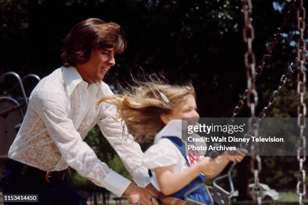 Bobby Sherman pushing young girl on swing on the ABC tv special 'The Bobby Sherman Special'.