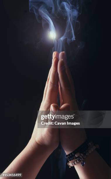 hands joined by the woman who prays - cult members stock pictures, royalty-free photos & images