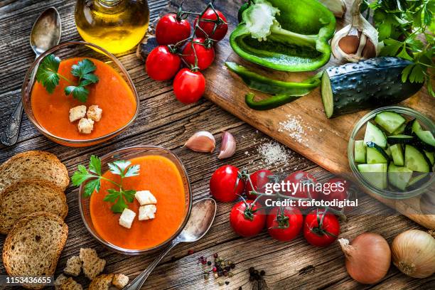 spanish gazpacho and ingredients on rustic wooden table - gazpacho stock pictures, royalty-free photos & images