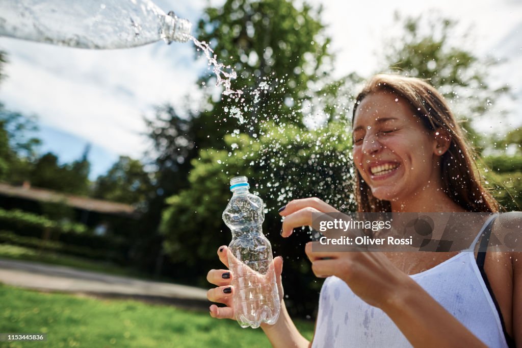 Splashed People Happy Young Woman Being Splashed With Water In A Park High-Res Stock ...
