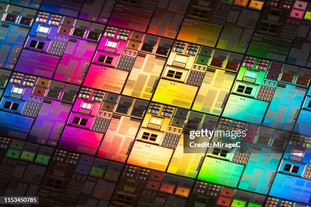 iridescent silicon computer wafer - silicon stock pictures, royalty-free photos & images