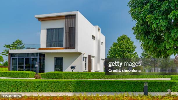 luxury bungalow in a residential area - bungalow house stock pictures, royalty-free photos & images