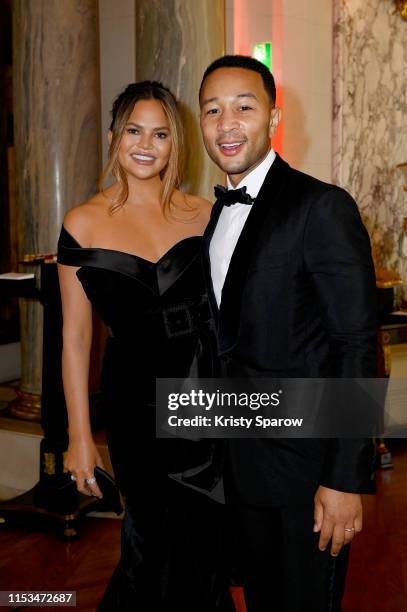 John Legend and Chrissy Teigen attend Pianists Lang Lang & Gina Alice Cocktail Wedding at Hotel Shangri-La on June 02, 2019 in Paris, France.