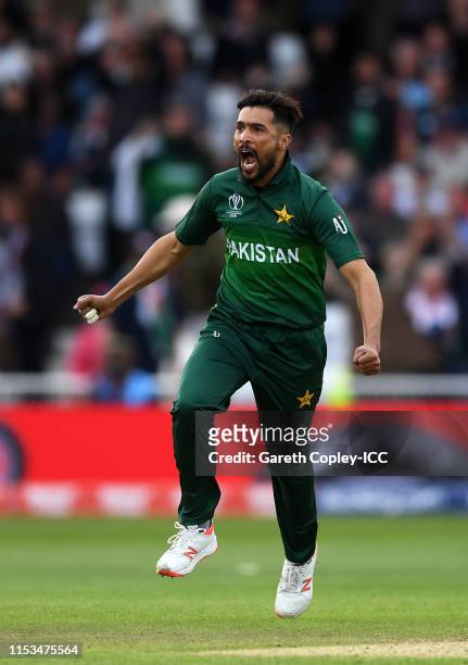 Mohammad Amir of Pakistan celebrates after taking the wicket of Jos Buttler during the Group Stage match of the ICC Cricket World Cup 2019 between...