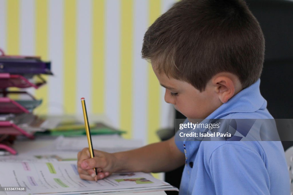 Seven Years Old Boy Doing Homework