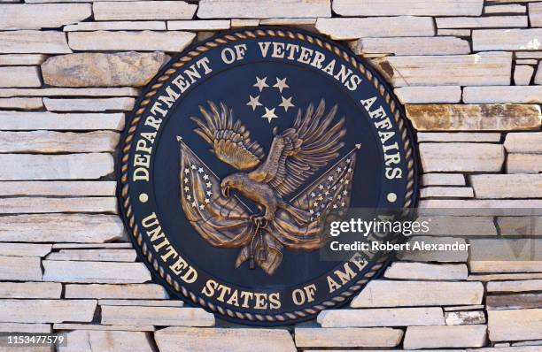 The seal of the United States Department of Veterans Affairs at the entrance to the Santa Fe National Cemetery in Santa Fe, New Mexico.