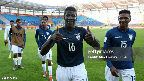 Sergio Quintero and Jesus Castillo of Ecuador smile as they leave the pitch following victory in the 2019 FIFA U-20 World Cup Round of 16 match...