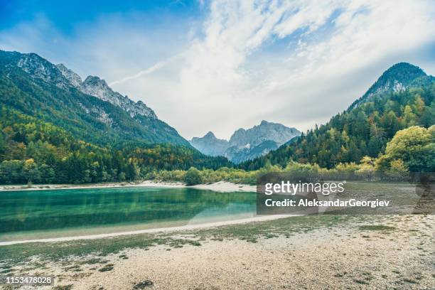 lake jasna beach in slovenian julian alps - slovenia mountains stock pictures, royalty-free photos & images