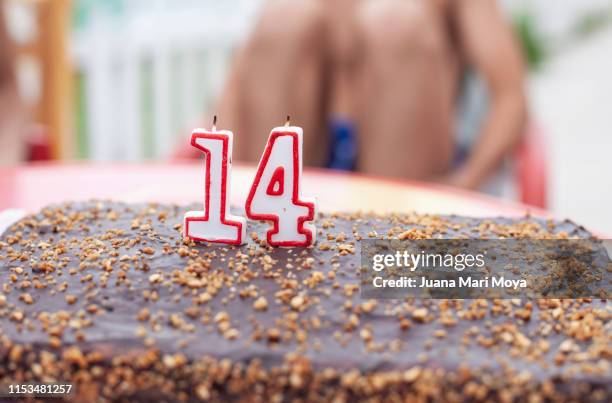 homemade cake with candles, to celebrate 14 years - 14 15 years imagens e fotografias de stock