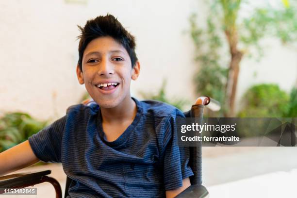 teenager boy with cerebral palsy - developmental disability stock pictures, royalty-free photos & images