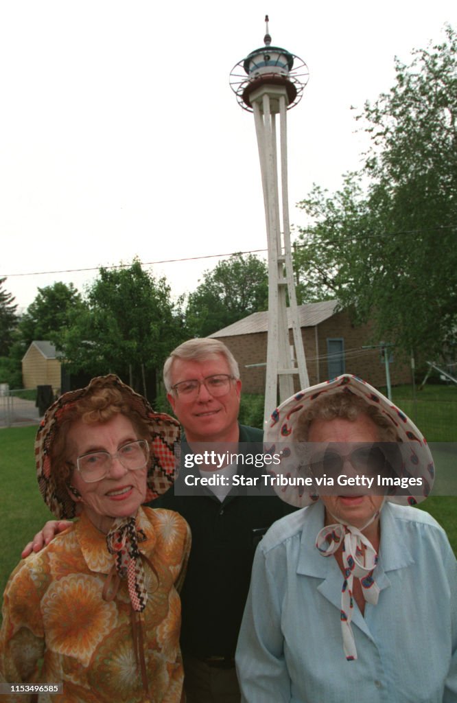 (left to right) Clara Stenseth, Clara Stenseth and Aletta Keeler (a visiting relative from Watertown S.D.) and their birdhouse modeled after the 1962 space needle in Seattle