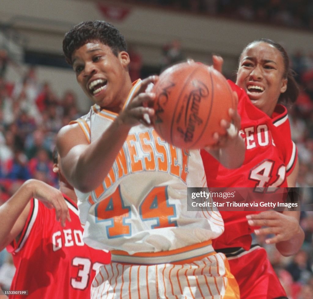 Pashen Thompson of Tennesse snags down a rebound over Tiffany Walker of Georiga during the fist half of NCAA semifinal action at the Target Center. photo by Jerry Holt 1995 NCAA Women's Final Four