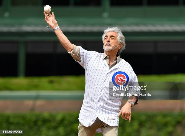 Joe Mantegna throws a ceremonial first pitch before the game between the Chicago Cubs and the Los Angeles Angels at Wrigley Field on June 03, 2019 in...