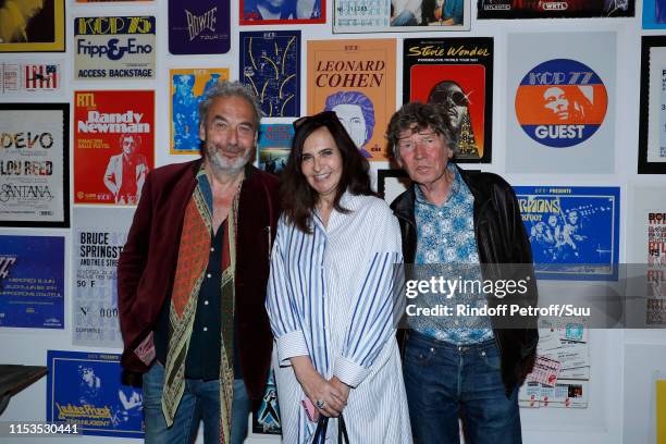 Nathalie Garcon standing between her husband Jean-Marie Duprez and director Etienne Chatiliez attend Albert Koski exposes its Rock&Roll Posters...