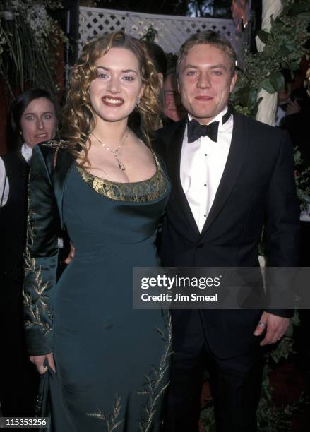 Kate Winslet and James Threapleton during The 70th Annual Academy Awards - Red Carpet at Shrine Auditorium in Los Angeles, California, United States.