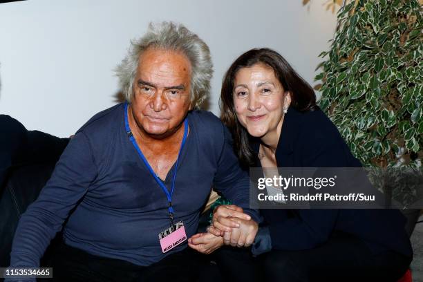 Producer Albert Koski and Ingrid Betancourt attend Albert Koski exposes its Rock&Roll Posters Collection at Galerie Laurent Godin on June 03, 2019 in...