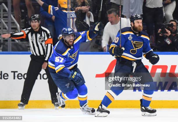 David Perron and Ryan O'Reilly of the St. Louis Blues celebrate O'Reilly's first period goal during Game Four of the 2019 NHL Stanley Cup Final...