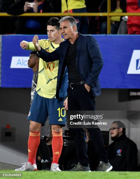 Carlos Queiroz coach of Colombia gives instructions to his player James Rodriguez during a friendly match between Colombia and Panama at Estadio El...