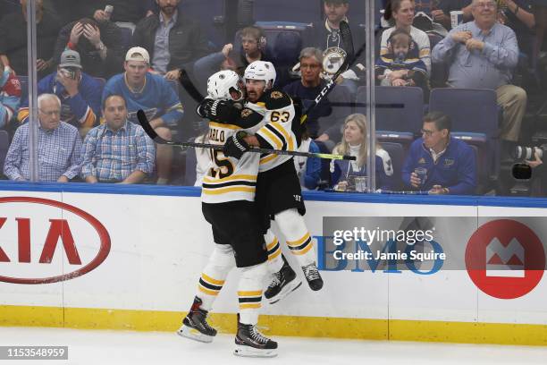 Brandon Carlo of the Boston Bruins celebrates his second period goal at 14:19 with Brad Marchand against the St. Louis Blues in Game Four of the 2019...