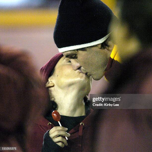 Alyssa Milano and Oakland Athletics pitcher and USC alumnus Barry Zito kiss at USC football game against Arizona at the Los Angeles Memorial Coliseum...