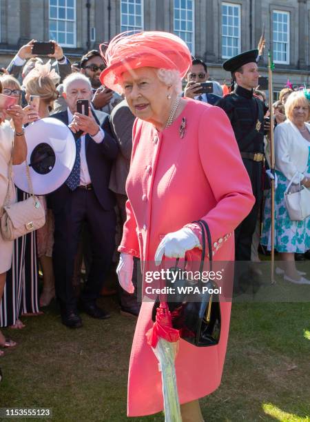 Queen Elizabeth II hosts a garden party at The Palace Of Holyroodhouse on July 3, 2019 in Edinburgh, Scotland.