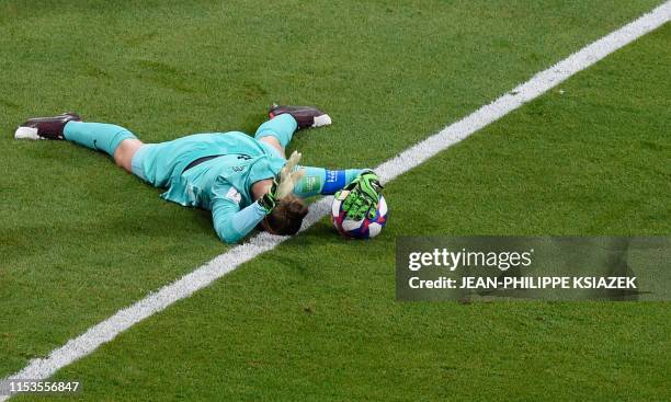 Netherlands' goalkeeper Sari van Veenendaal reacts after saving a ball during the France 2019 Women's World Cup semi-final football match between the...