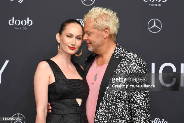 Uwe Fahrenkrog-Petersen and his girlfriend Christin Dechant come to the designer Michalsky's show at the E-Werk. The collections for Spring/Summer...