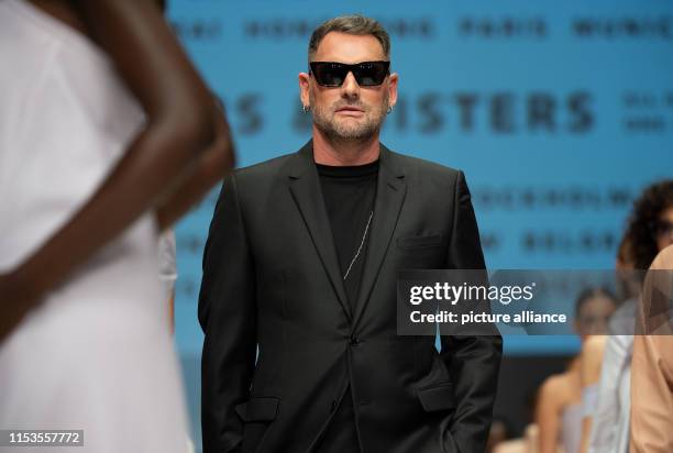 Designer Michael Michalsky walks down the catwalk after his show at the E-Werk. The collections for Spring/Summer 2020 will be presented at Berlin...