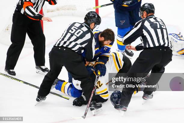 David Backes of the Boston Bruins and Alex Pietrangelo of the St. Louis Blues mix it up in Game Four of the 2019 NHL Stanley Cup Final at Enterprise...