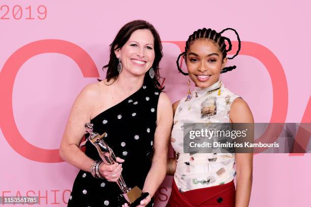 Lisa McKnight poses with Barbie's Award for Board of Tribute Award and Yara Shahidi on the Winners Walk during the CFDA Fashion Awards at the...