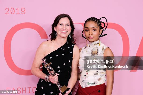 Lisa McKnight poses with Barbie's Award for Board of Tribute Award and Yara Shahidi on the Winners Walk during the CFDA Fashion Awards at the...