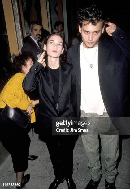 Johnny Depp and Winona Ryder during "Pacific Heights" Los Angeles Premiere at Avco Westwood Theatre in Los Angeles, CA, United States.