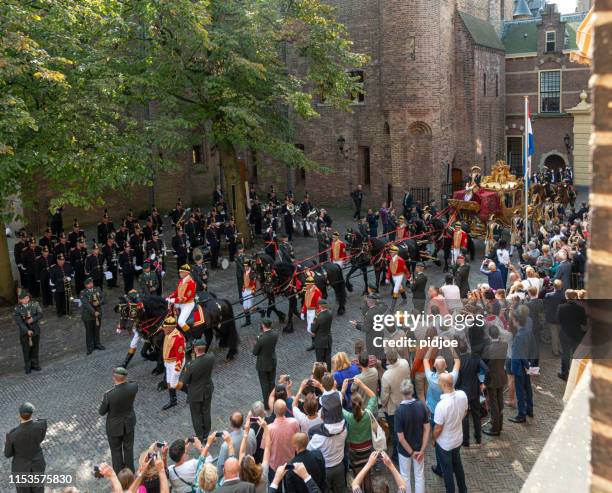 dutch royals leaving binnenhof during prinsjesdag in the hague - prinsjesdag princes day celebration in the hague stock pictures, royalty-free photos & images