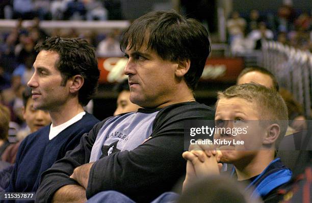 Dallas Mavericks owner Mark Cuban and a young Dallas fan watch during the Mavericks' 101-92 loss to the Los Angeles Clippers at the Staples Center in...