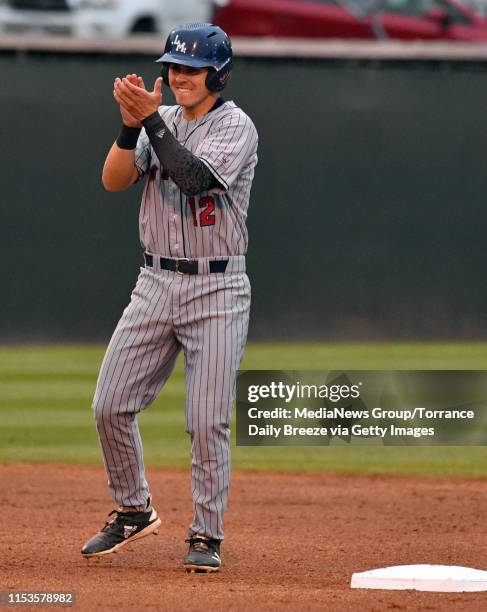 S Trevin Esquerra celebrates at second base after a hit by Tommy Delgado at Jackie Robinson Stadium in Los Angeles on Monday, June 3, 2019.