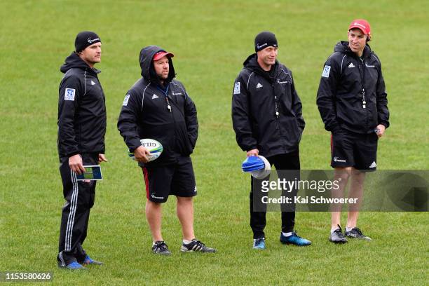 Head Coach Scott Robertson, Assistant Coach Jason Ryan, Assistant Coach Ronan O'Gara and Assistant Coach Andrew Goodman look on during a Crusaders...