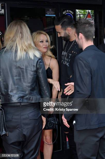 Pamela Anderson and Adil Rami attend the "Bionic ShowGirl" Premiere at Le Crazy Horse on June 03, 2019 in Paris, France.