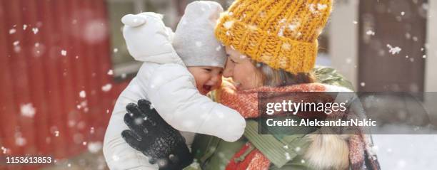 baby's first snow - winter baby stock pictures, royalty-free photos & images