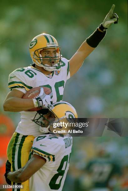 Antonio Freeman of the Green Bay Packers celebrates a touchdown with teammate Robert Brooks during Superbowl XXXII against the Denver Broncos on 28th...