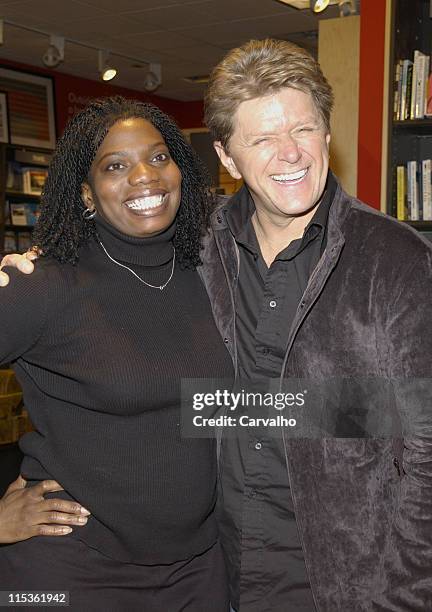 Peter Cetera and a Borders employee during Peter Cetera Signs His CD "You Just Gotta Love Christmas" at Borders in New York City in New York, New...